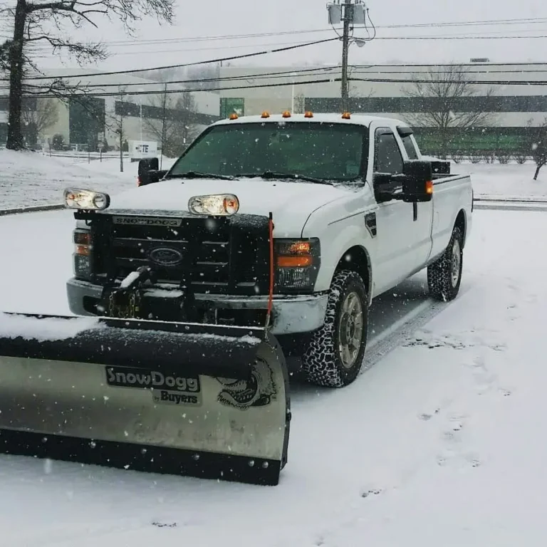 Professional snow removal truck clearing snow in Fort Saskatchewan for safe and accessible residential and commercial properties