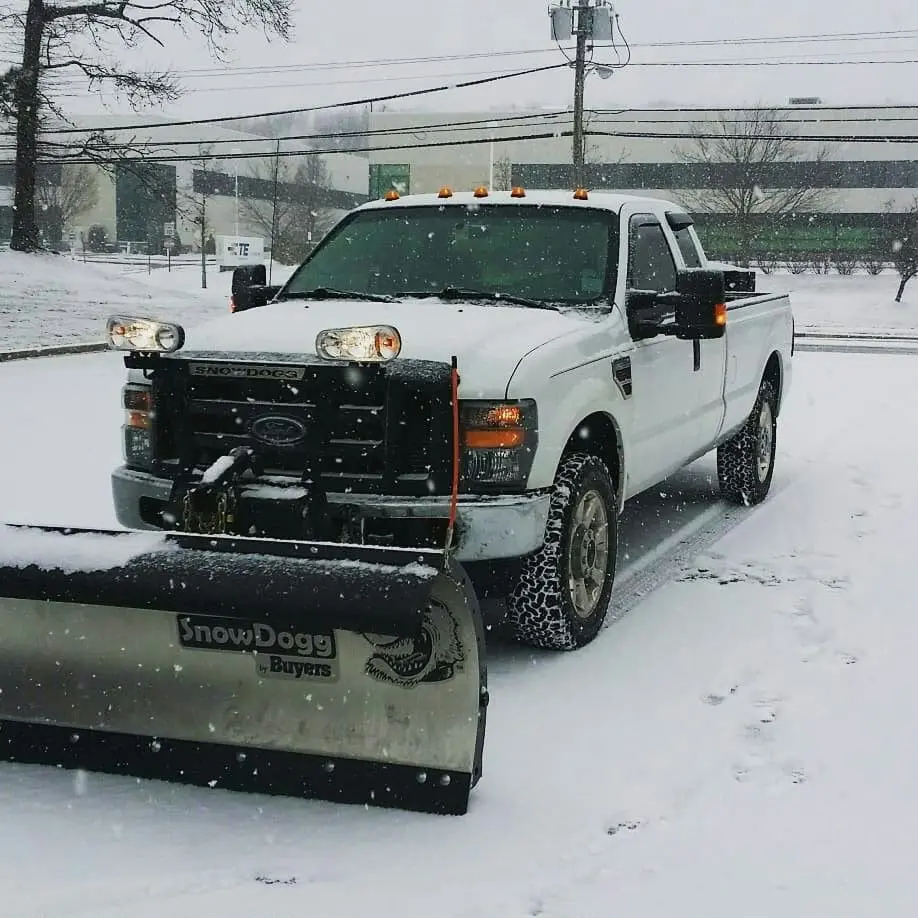 Professional snow removal truck clearing snow in Fort Saskatchewan for safe and accessible residential and commercial properties